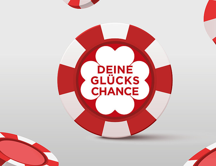 Glückschance Jeton auf grauem Hintergrund 